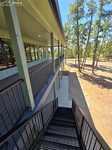 a view of a balcony with wooden floor