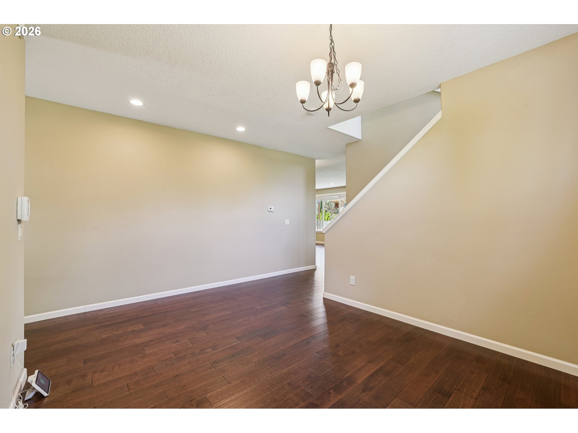 2117 Southeast Cochran Drive Gresham, OR 97080 - Photo 12 of 48 a view of an empty room with wooden floor