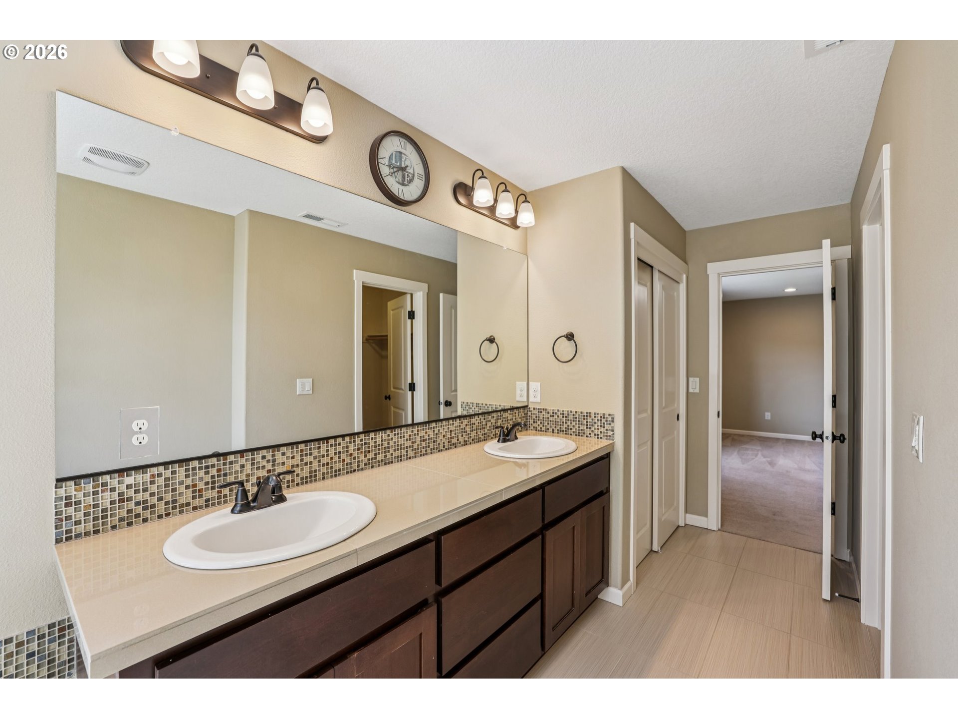 2117 Southeast Cochran Drive Gresham, OR 97080 - Photo 28 of 48 a bathroom with a sink and a mirror