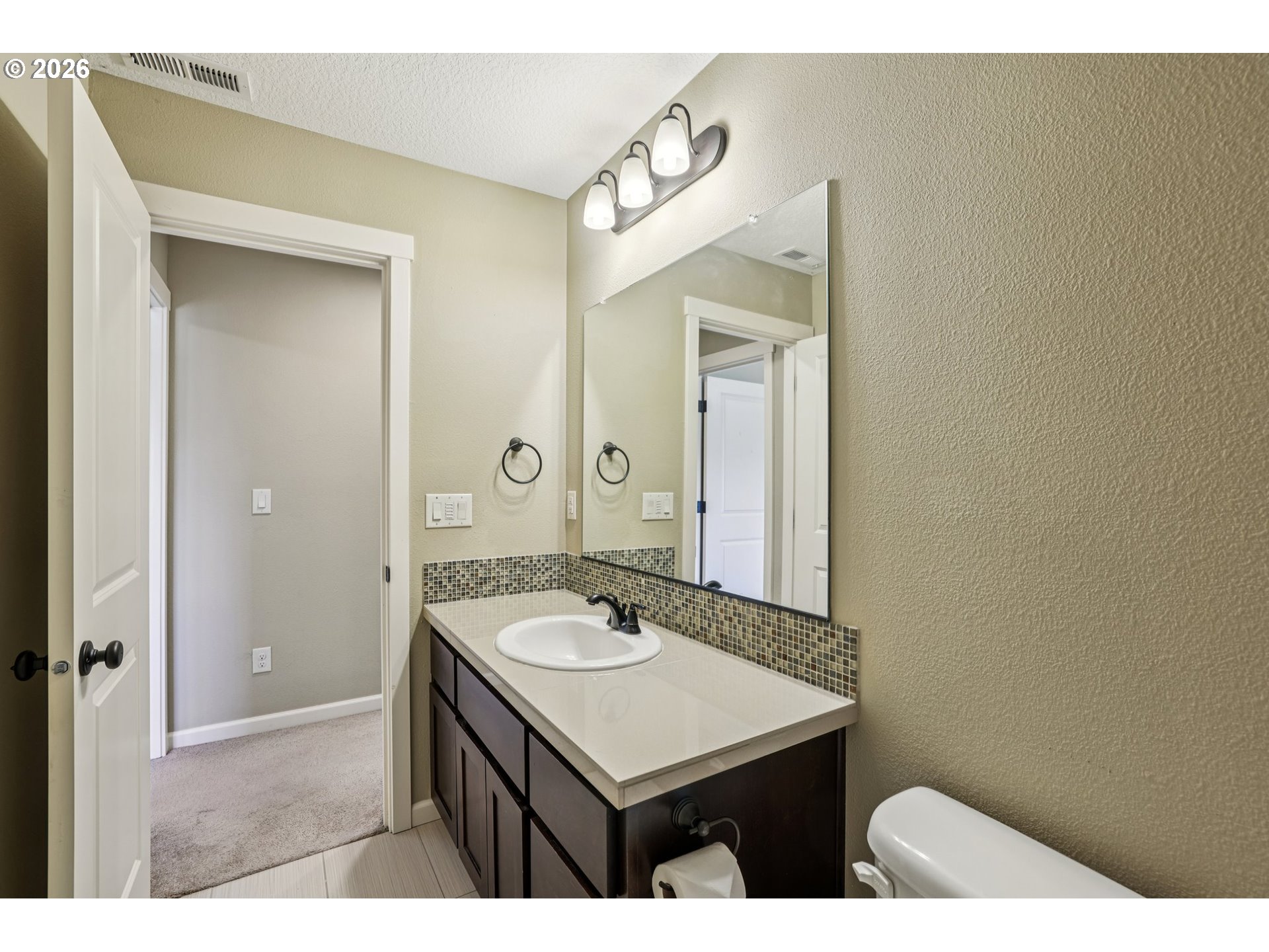 2117 Southeast Cochran Drive Gresham, OR 97080 - Photo 36 of 48 a bathroom with a sink and a mirror