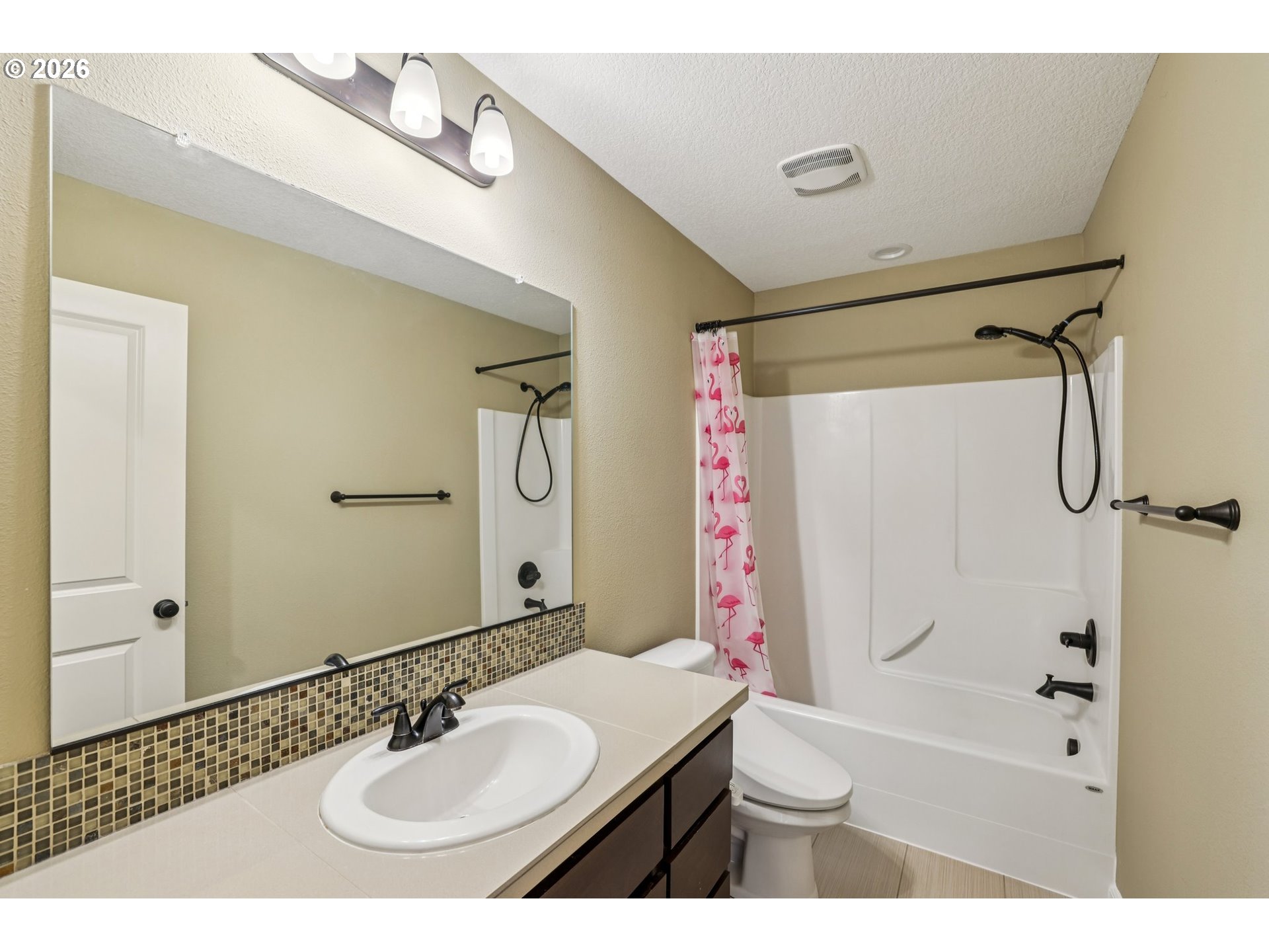 2117 Southeast Cochran Drive Gresham, OR 97080 - Photo 37 of 48 a bathroom with a sink and a mirror