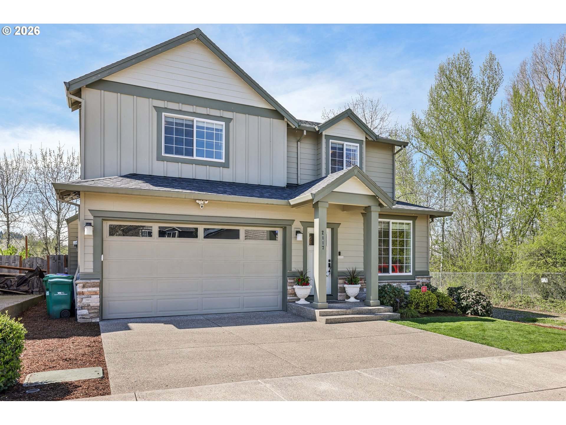 2117 Southeast Cochran Drive Gresham, OR 97080 - Photo 4 of 48 a front view of a house with a yard and garage