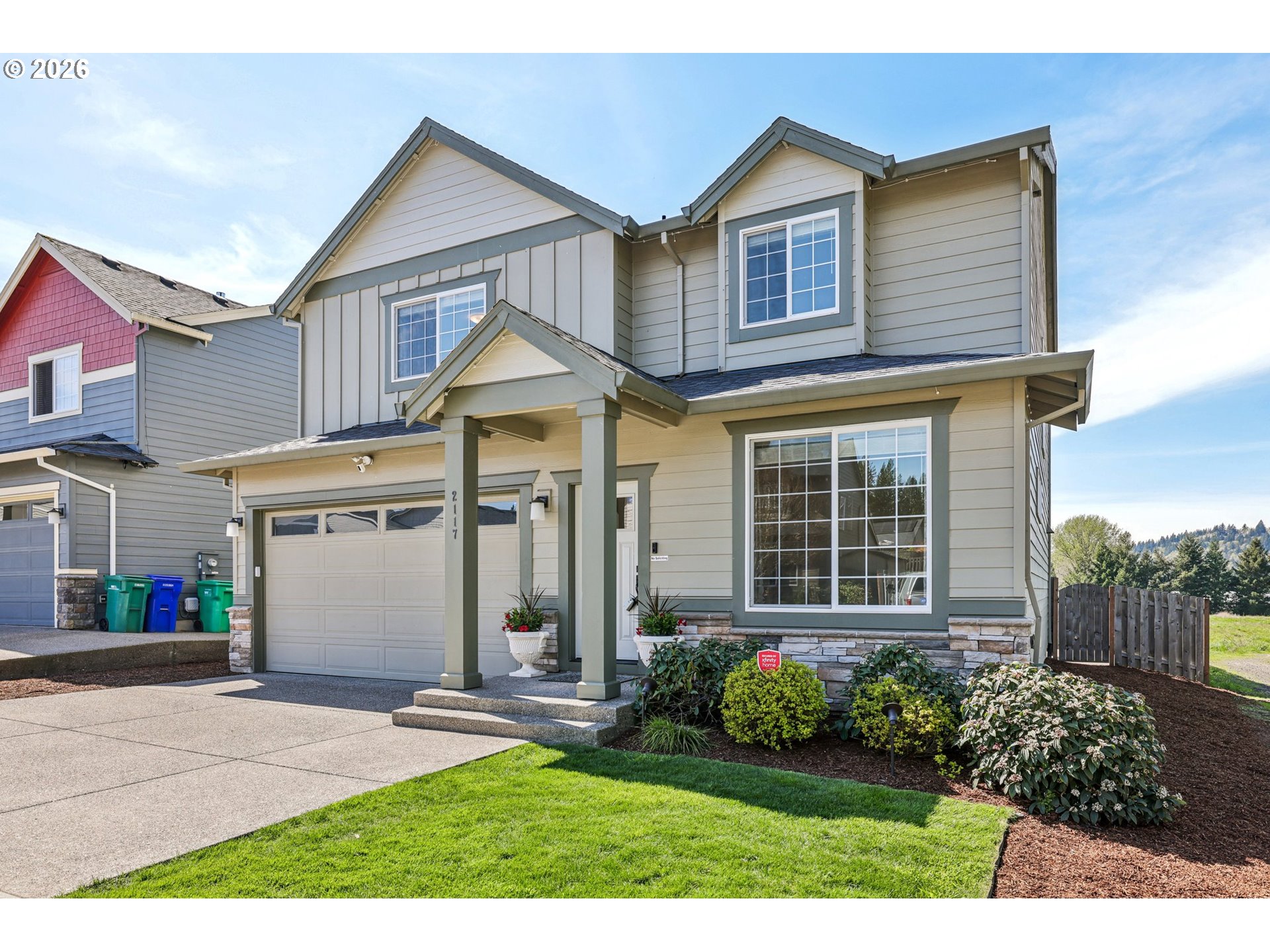 2117 Southeast Cochran Drive Gresham, OR 97080 - Photo 5 of 48 a front view of a house with garden