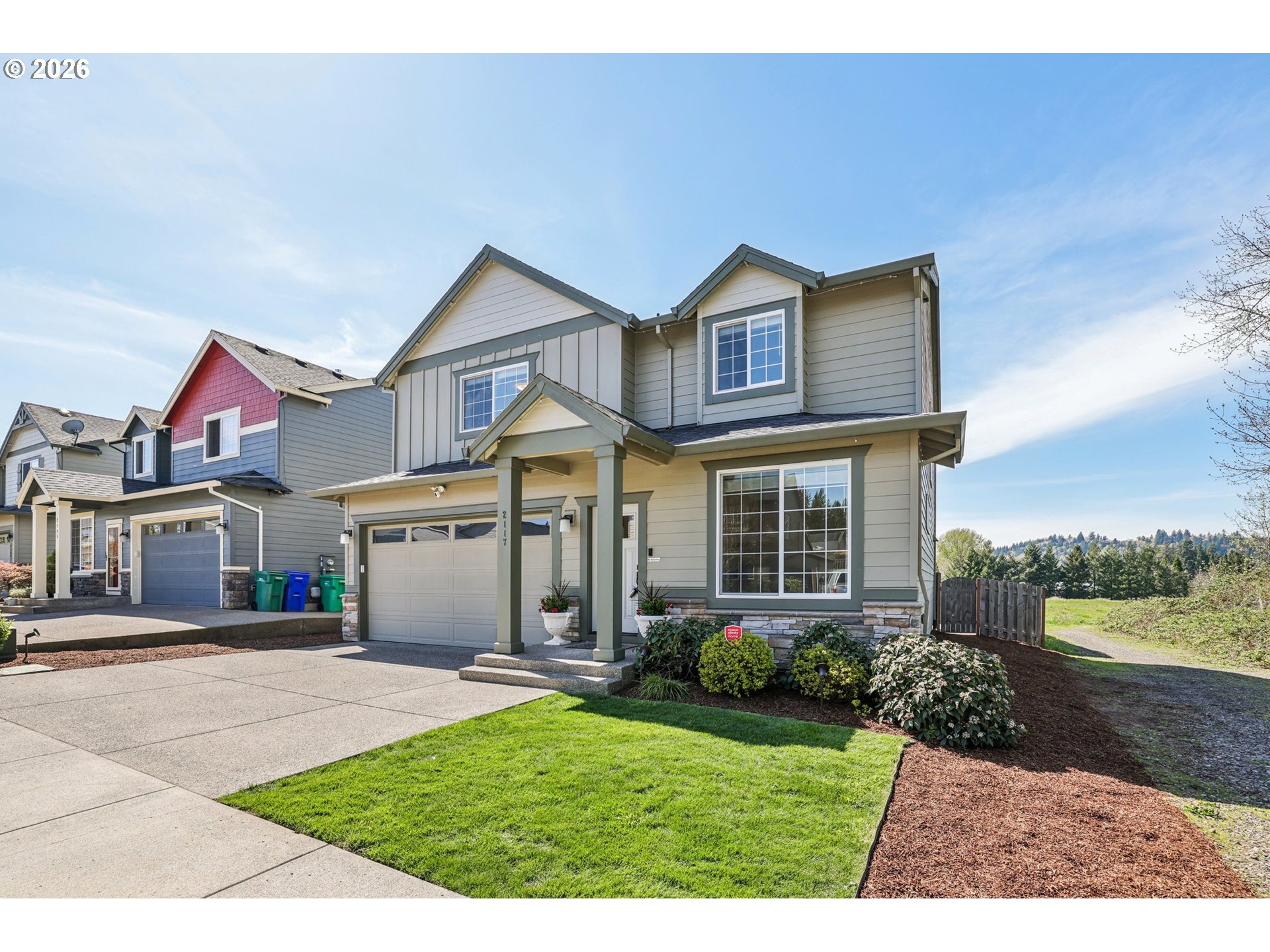 2117 Southeast Cochran Drive Gresham, OR 97080 - Photo 6 of 48 a front view of a house with garden