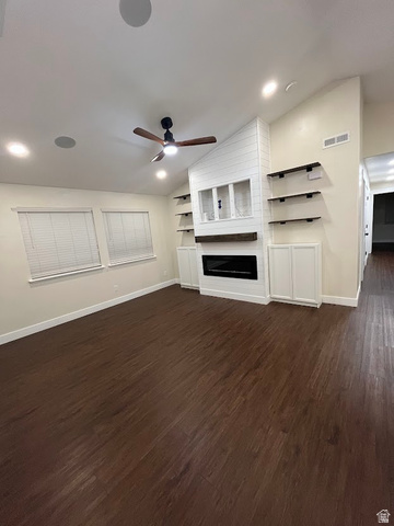 1768 West 1300th Street South, Unit 305 Springville, UT 84663 - Photo 3 of 26 Living room featuring an built in entertainment center, electric fireplace, vaulted ceiling, ceiling fan, and recessed lighting