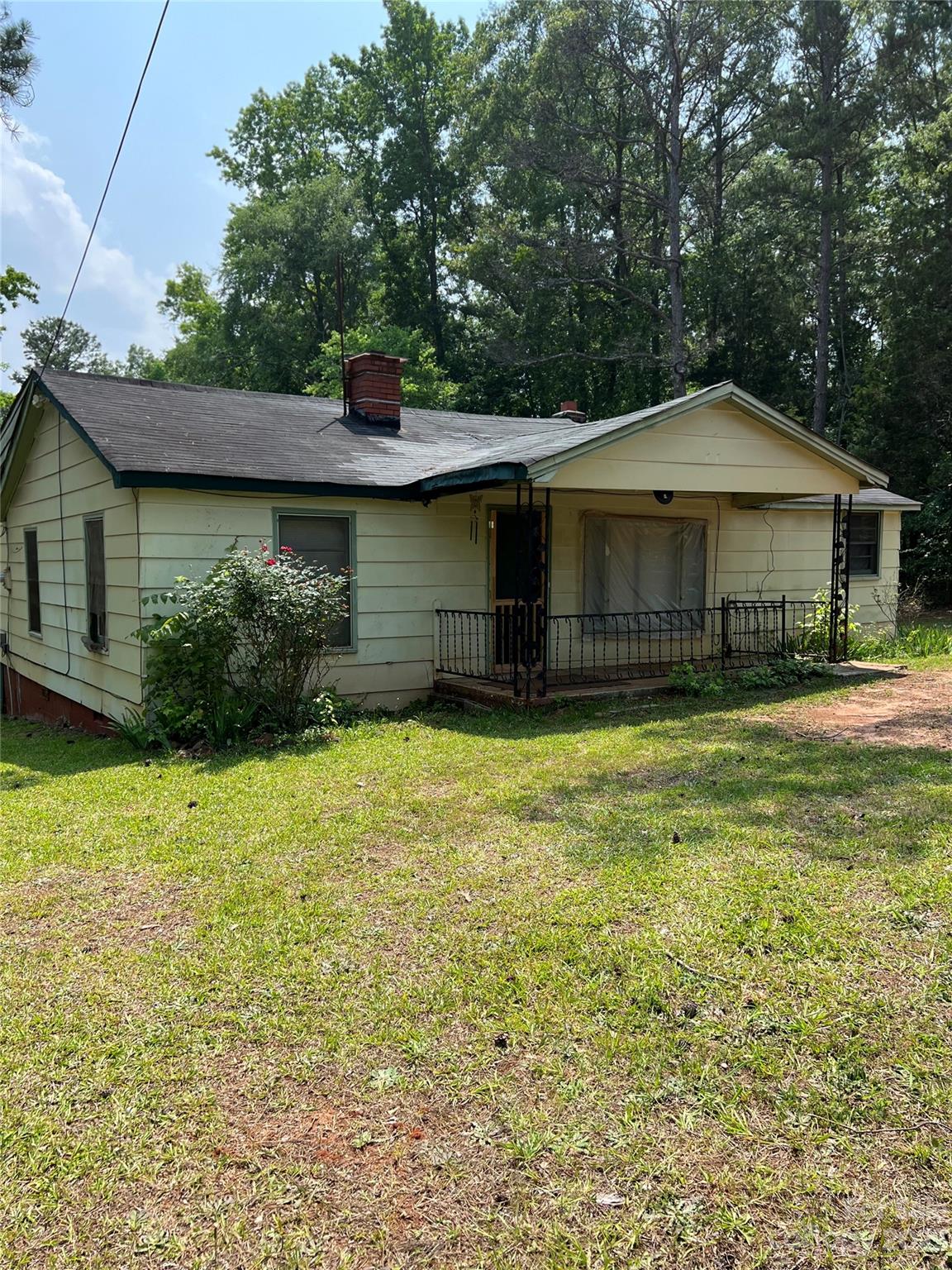4425 Georges Bridge Road Sharon, SC 29742 - Photo 2 of 6 a front view of a house with a garden