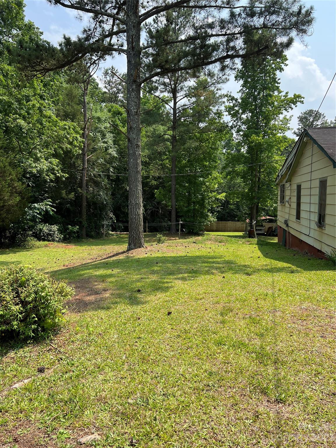 4425 Georges Bridge Road Sharon, SC 29742 - Photo 3 of 6 a view of a swimming pool with an outdoor space and seating area