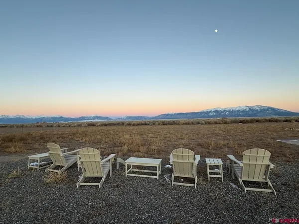 a view of a balcony with chairs