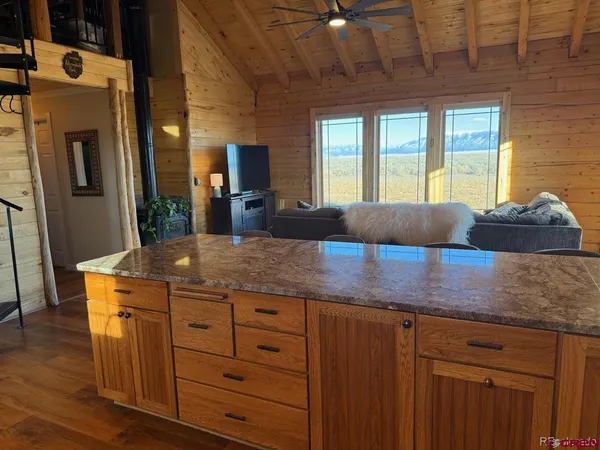 a kitchen with cabinets and window