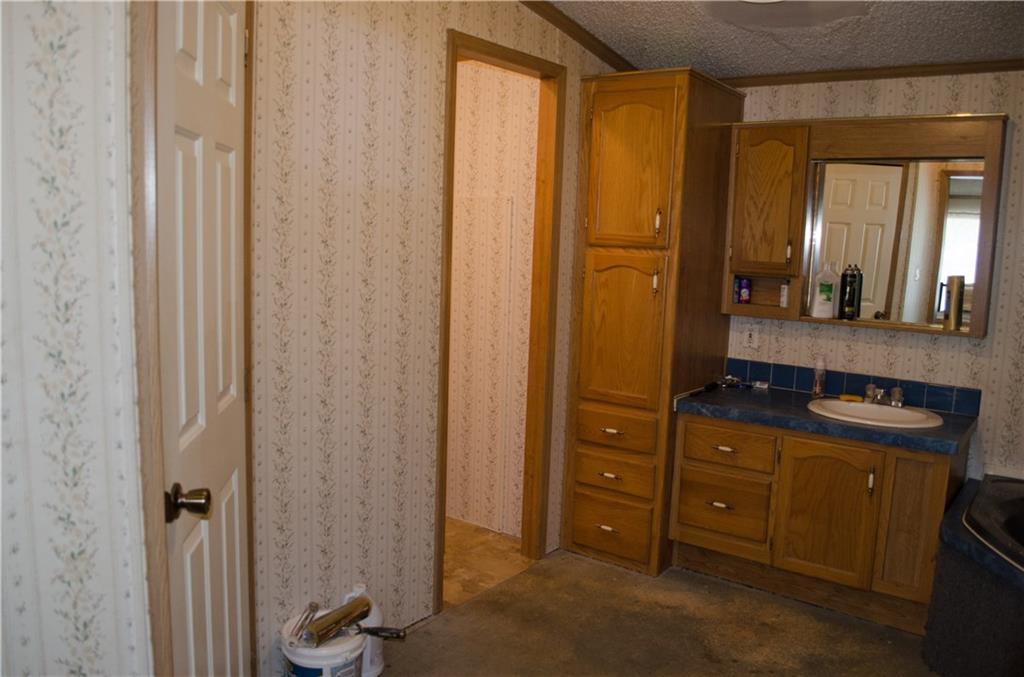 2401 Hudson Road Hudson, ME 04449 - Photo 12 of 26 Master bath has lot of cabinets, a...
