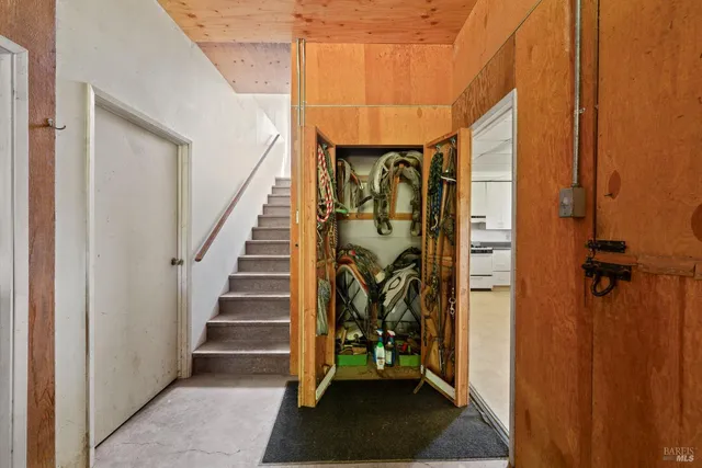 a view of an entryway with wooden floor and a front door