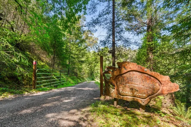 a backyard of a house with a yard and outdoor seating