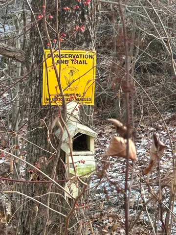 a sign on the side of the road