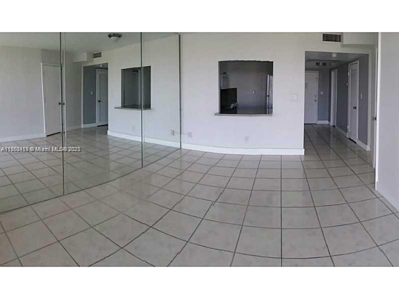 5401 Collins Avenue, Unit 829 Miami Beach, FL 33140 - Photo 18 of 29 a bathroom view with a sink and a mirror