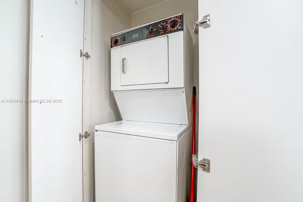 5401 Collins Avenue, Unit 829 Miami Beach, FL 33140 - Photo 25 of 29 a utility room with dryer and washer