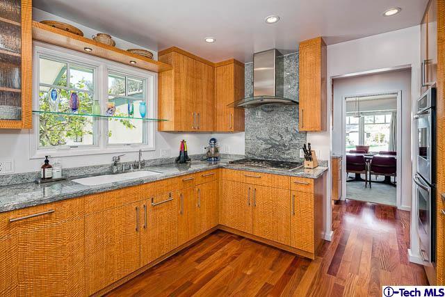 1270 Wynn Road Pasadena, CA 91107 - Photo 11 of 37 a kitchen with stainless steel appliances granite countertop wooden floors and sink
