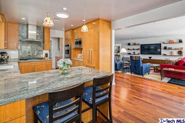 1270 Wynn Road Pasadena, CA 91107 - Photo 12 of 37 a kitchen with stainless steel appliances granite countertop a sink table and chairs