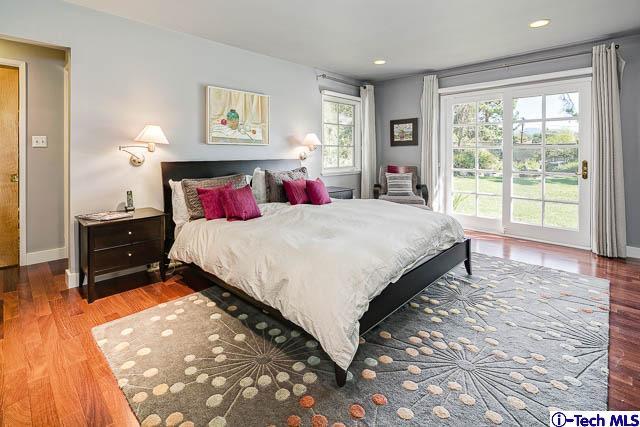 1270 Wynn Road Pasadena, CA 91107 - Photo 19 of 37 a living room with a bed dresser and a large window