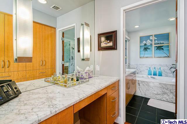 1270 Wynn Road Pasadena, CA 91107 - Photo 22 of 37 a bathroom with a granite countertop sink and a mirror