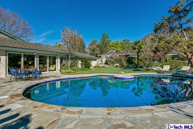1270 Wynn Road Pasadena, CA 91107 - Photo 30 of 37 a view of a swimming pool with a patio