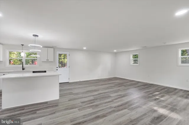 a view of kitchen with wooden floor and window