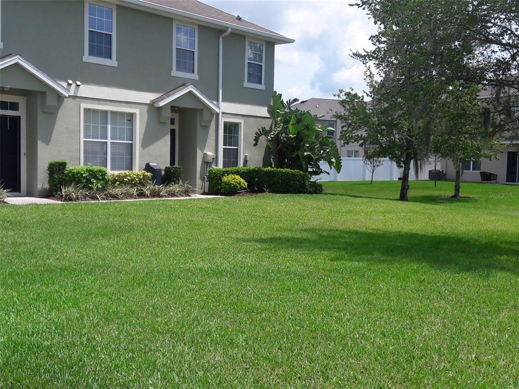 2336 Tanbark Ridge Place Plant City, FL 33563 - Photo 1 of 1 a front view of a house with a yard