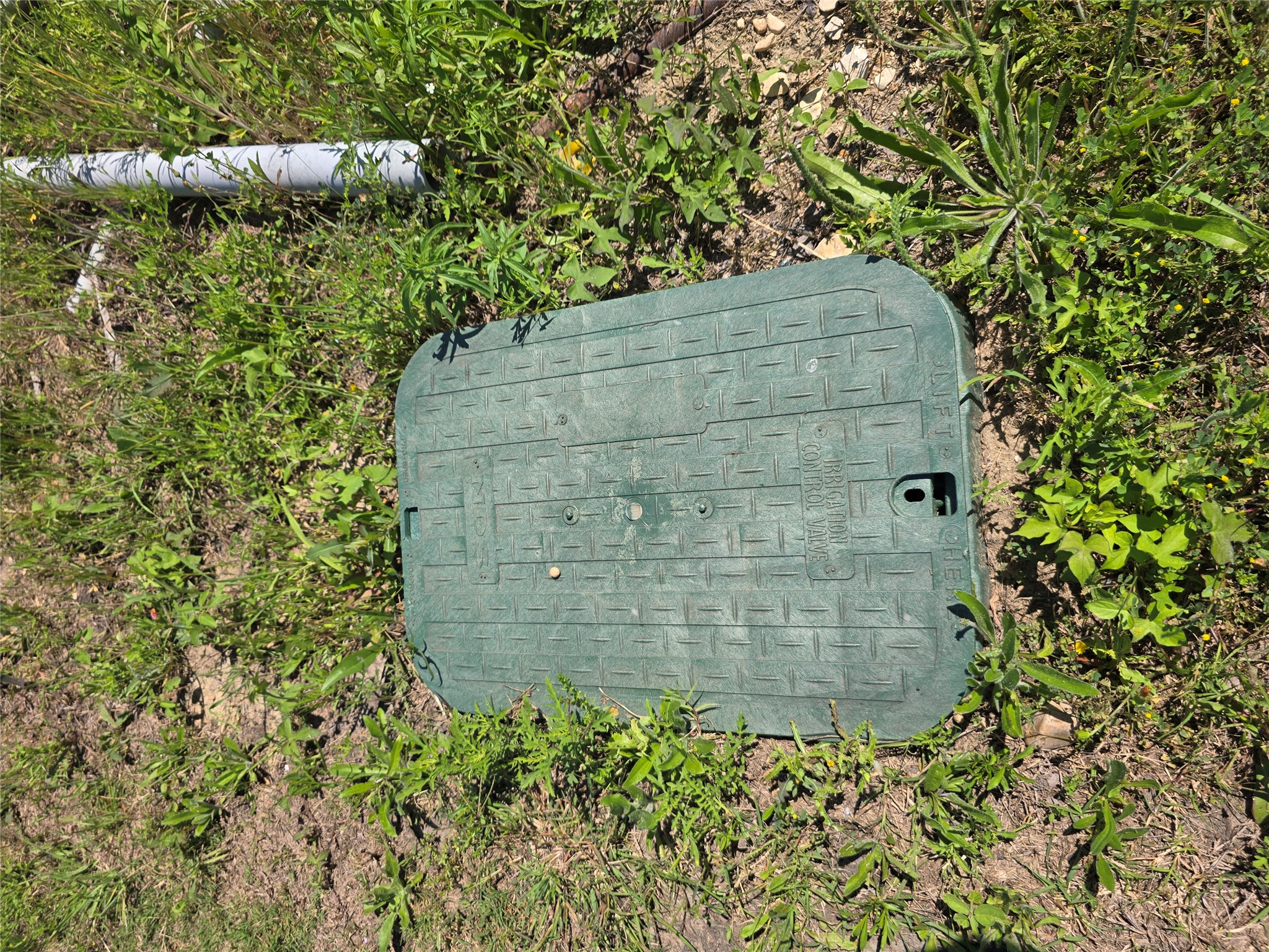 693 Santa Teresa Road Kyle, TX 78640 - Photo 16 of 20 A glimpse at the essential underground irrigation control valve in the yard.