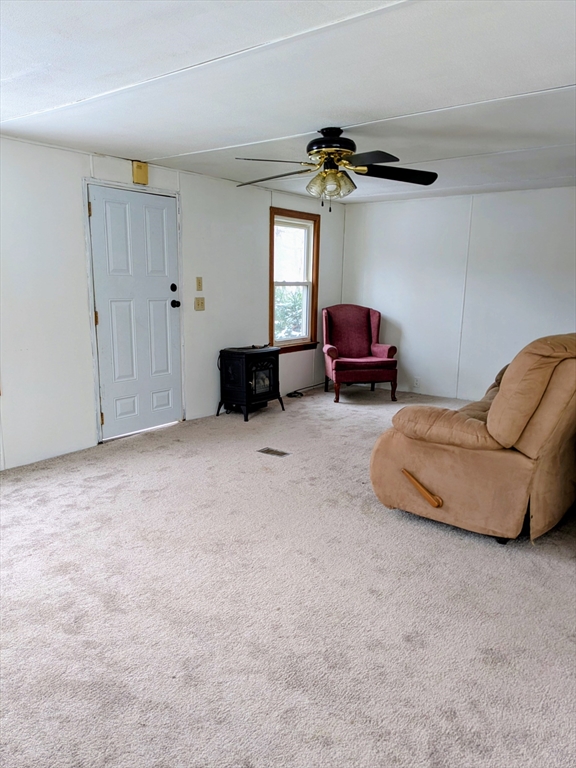 238 Brookfield Road Brimfield, MA 01010 - Photo 27 of 28 a living room with furniture and a chandelier