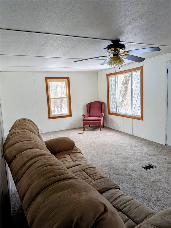 238 Brookfield Road Brimfield, MA 01010 - Photo 28 of 28 a bedroom with a bed couch and window