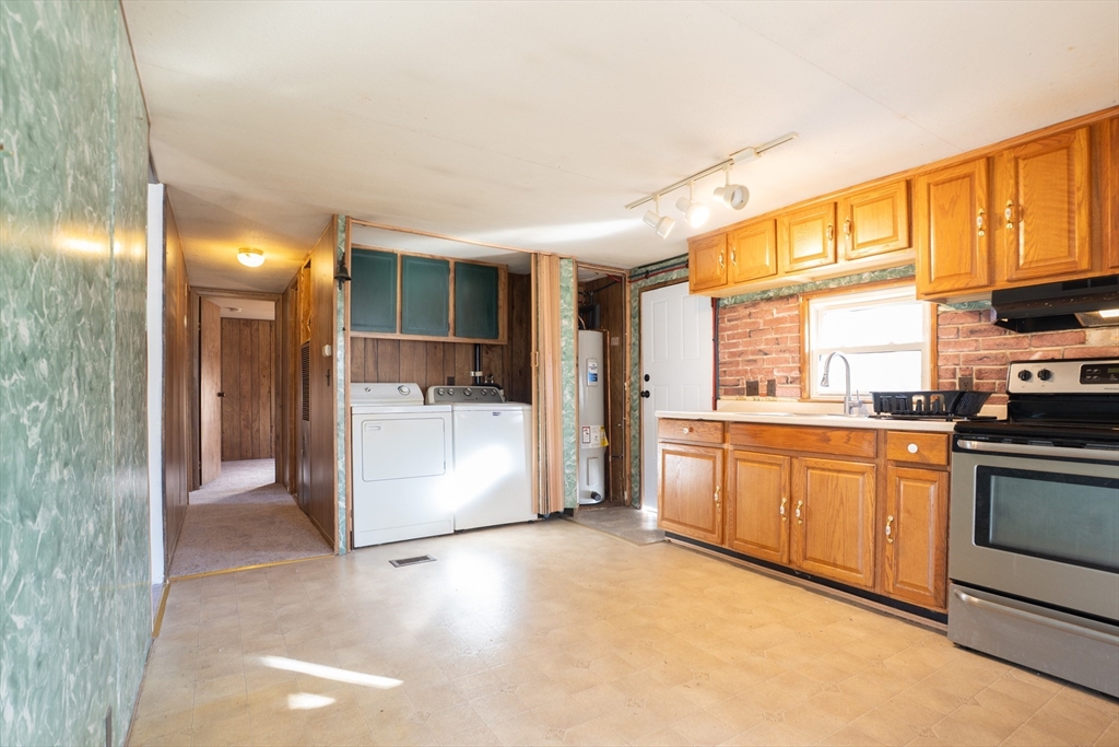 238 Brookfield Road Brimfield, MA 01010 - Photo 5 of 28 a kitchen with granite countertop a stove a sink and a refrigerator