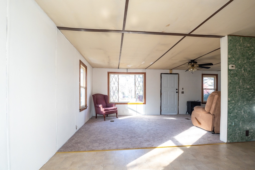238 Brookfield Road Brimfield, MA 01010 - Photo 8 of 28 a spacious bedroom with a bed and wooden floor