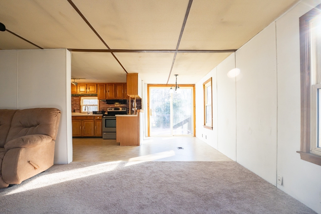238 Brookfield Road Brimfield, MA 01010 - Photo 9 of 28 a view of a kitchen with a refrigerator and a sink