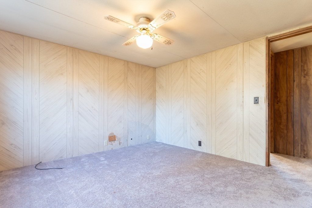 238 Brookfield Road Brimfield, MA 01010 - Photo 10 of 28 an empty room with closet and a chandelier fan