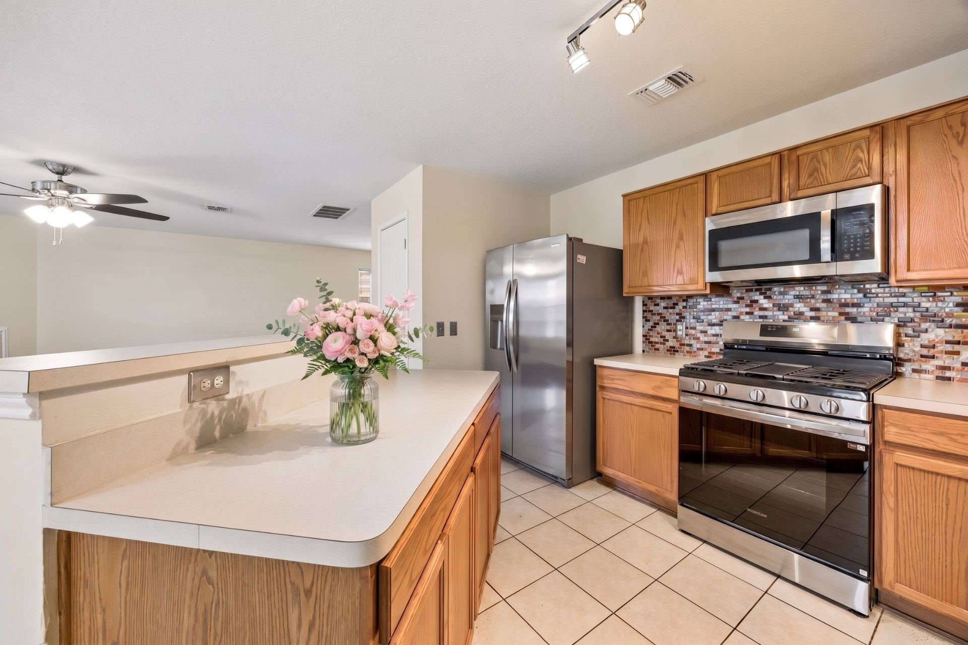 527 Cypresswood Knoll Spring, TX 77373 - Photo 4 of 15 a kitchen with stainless steel appliances a sink stove and refrigerator