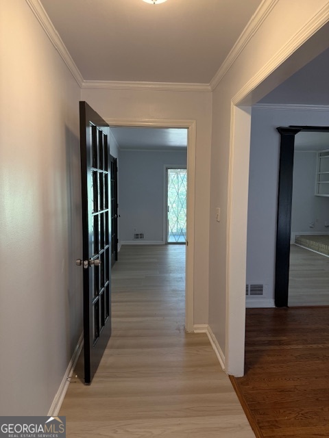 4405 Bakers Ferry Road Southwest Atlanta, GA 30331 - Photo 3 of 18 a hallway with wooden floor and stairs