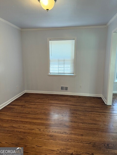 4405 Bakers Ferry Road Southwest Atlanta, GA 30331 - Photo 6 of 18 a view of a room with wooden floor and window