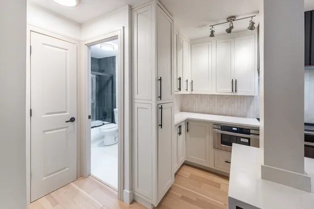 a bathroom with a shower and a sink