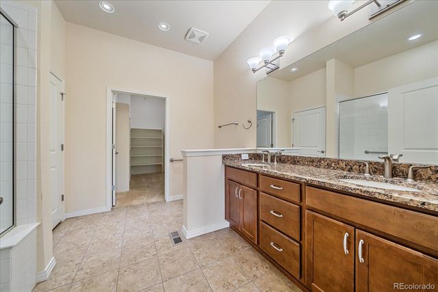 a bathroom with a glass shower door
