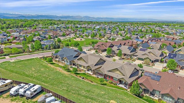 an aerial view of residential houses with outdoor space and street view