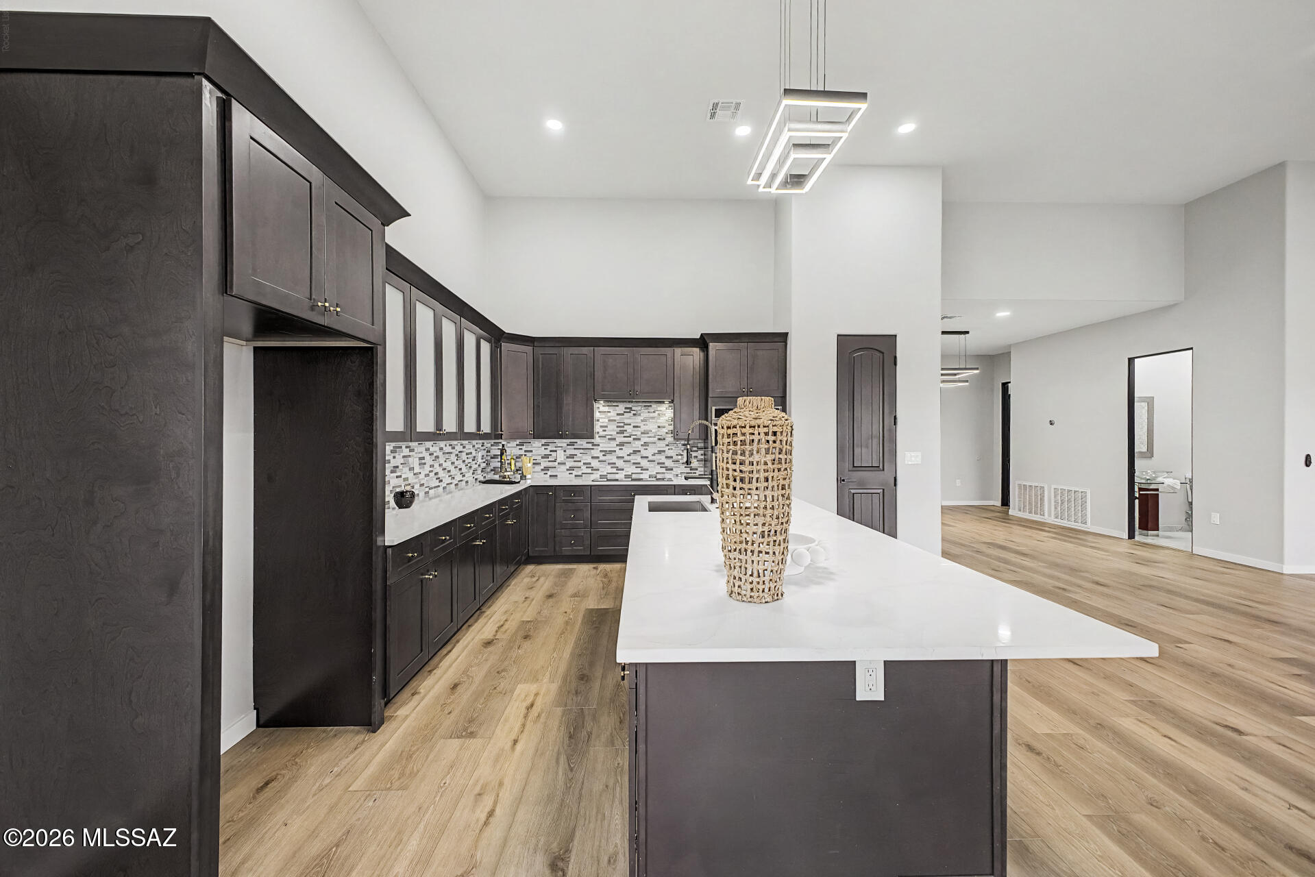 2399 Della Roccia Court Tucson, AZ 85737 - Photo 11 of 34 a large kitchen with kitchen island a sink stainless steel appliances and cabinets