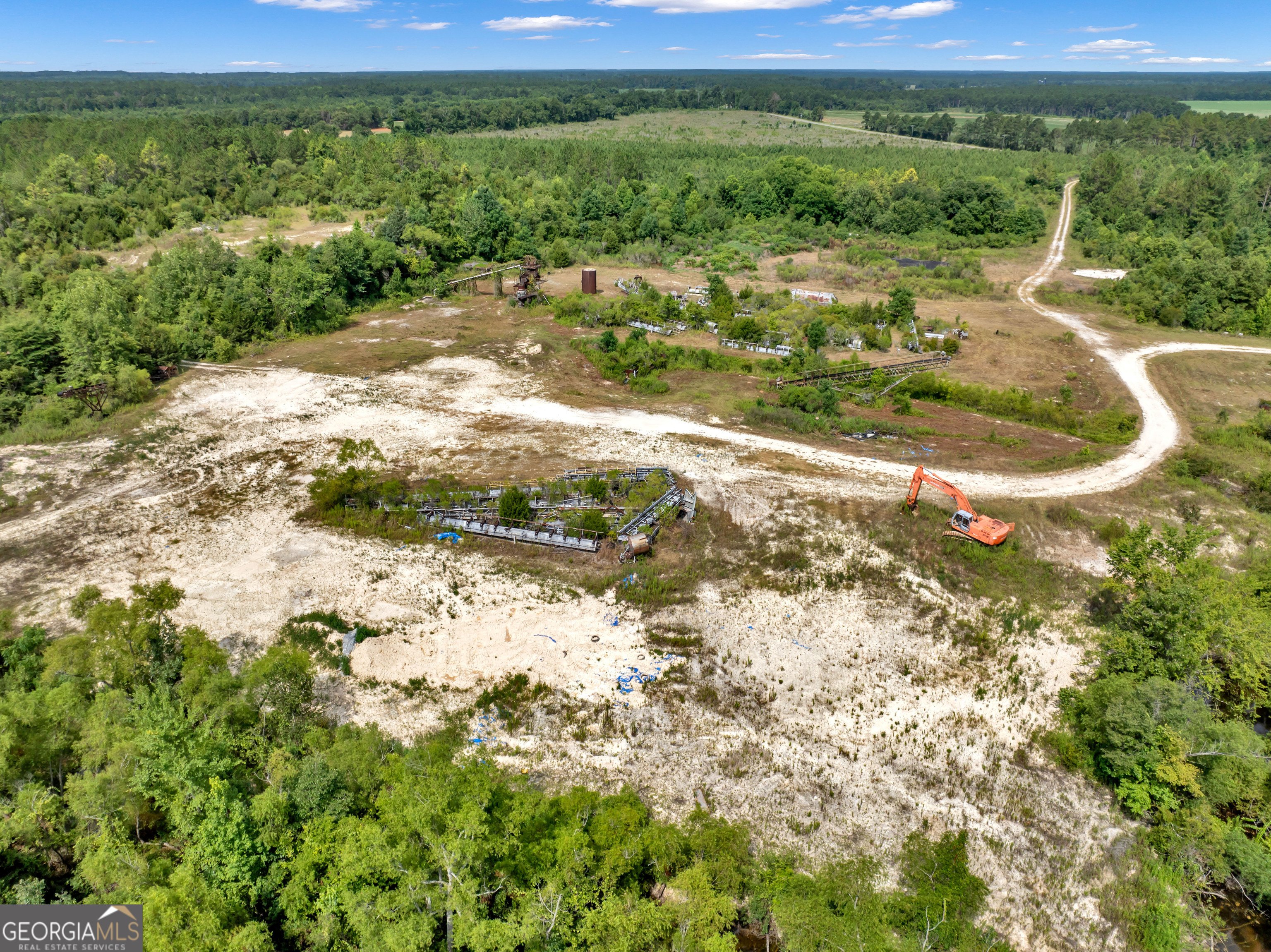 0 Harrell Road Whigham, GA 39897 - Photo 28 of 39 a view of a lake with a city