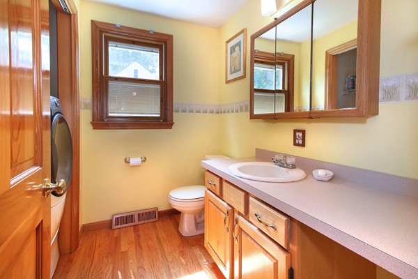 34 Ridge Road Pepperell, MA 01463 - Photo 5 of 30 a bathroom with a granite countertop sink mirror vanity and toilet