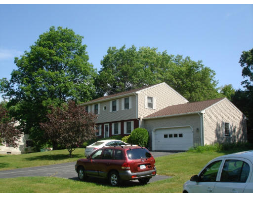 89 Upper Gore Road Webster, MA 01570 - Photo 3 of 22 a car parked in front of a house