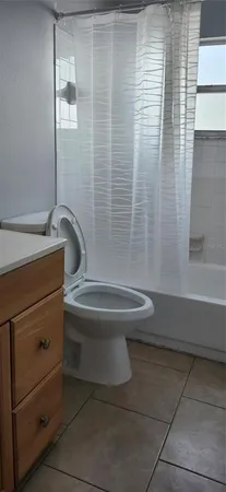 a bathroom with a toilet and a sink