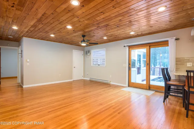 a view of a living room a kitchen island furniture and a kitchen view