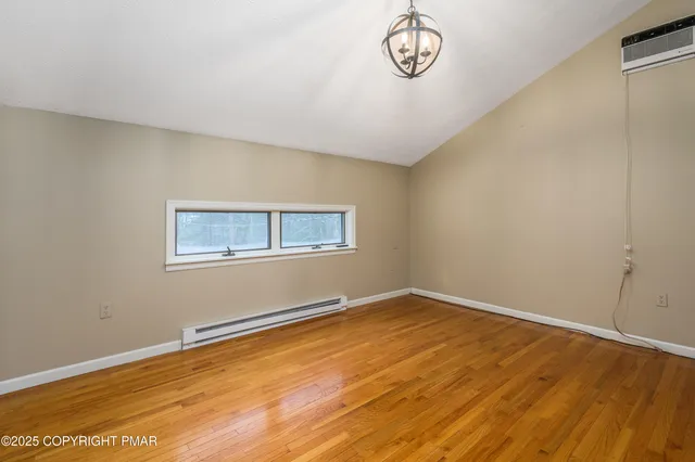 a kitchen with granite countertop a refrigerator stove and microwave