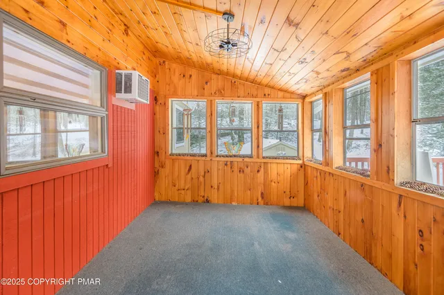 a view of balcony with wooden floor and bench