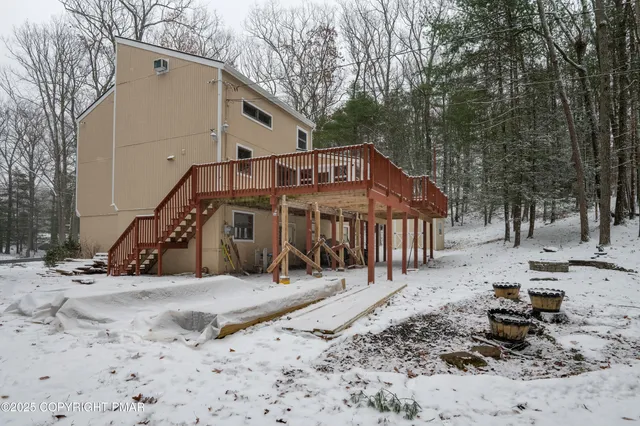 a view of a balcony with yard