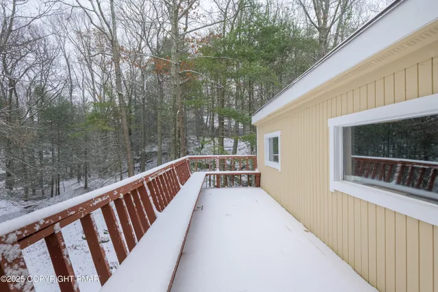 a view of balcony with wooden floor