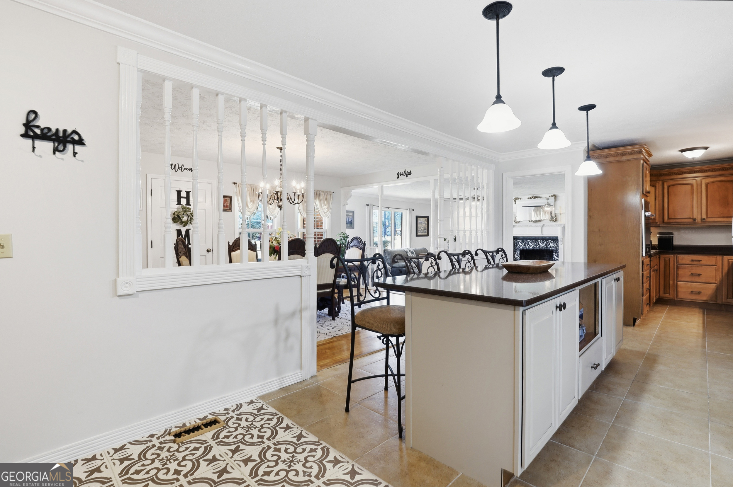 333 Rainbow Ridge Swainsboro, GA 30401 - Photo 12 of 46 a kitchen with stainless steel appliances a refrigerator a sink dishwasher a stove and white cabinets with wooden floor